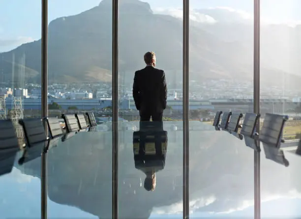 Group leadership overlooking the city from the boardroom